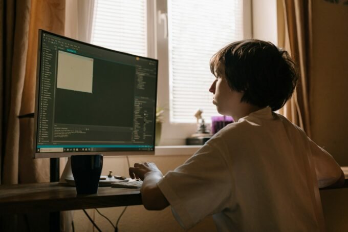 Coding class with kids using a monitor